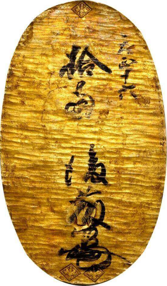 the front side of a Japanese Gold Oban had its denomination inscribed in black ink