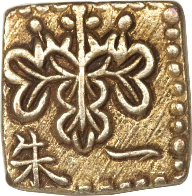 the Paulownia crest can be seen at the top of the obverse side of Japanese Shu gold coins like this 1 Shu gold coin