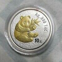 reverse side of the gilded 2000 issue of the 1 oz BU Chinese Silver Panda coin
