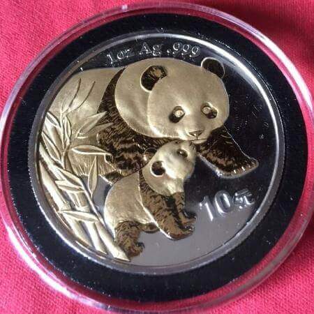 reverse side of the gilded 2004 issue of the 1 oz BU Chinese Silver Panda coin